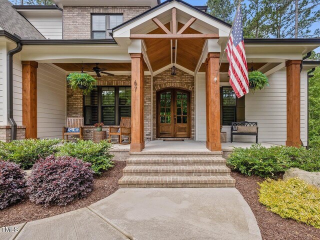 67 Spring Hollow Ct, Pittsboro, NC 27312 - property entrance with covered porch, ceiling fan, and brick siding