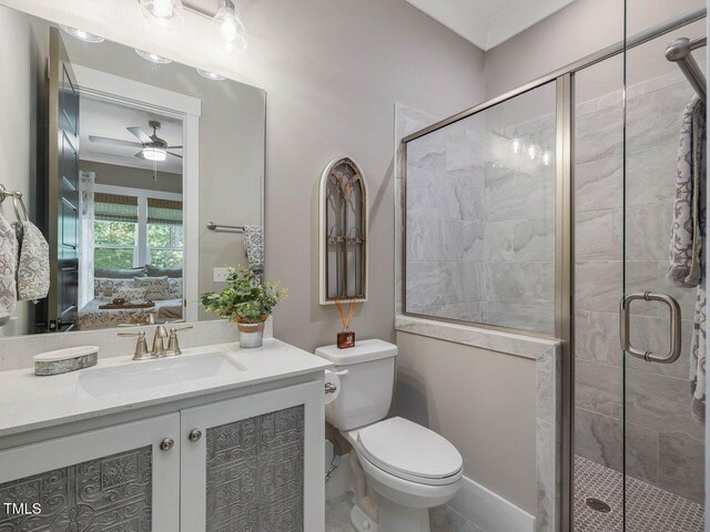 67 Spring Hollow Ct, Pittsboro, NC 27312 - full bath featuring vanity, a stall shower, toilet, a ceiling fan, and ensuite bathroom