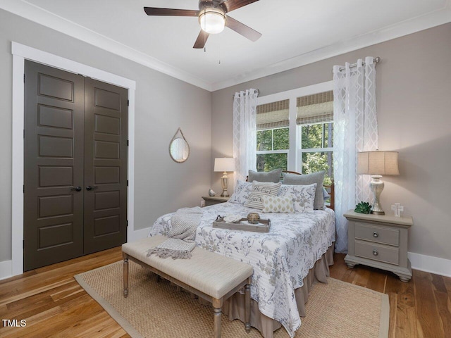 67 Spring Hollow Ct, Pittsboro, NC 27312 - bedroom with wood finished floors, ornamental molding, ceiling fan, and baseboards