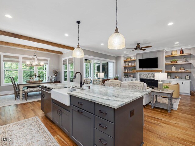 67 Spring Hollow Ct, Pittsboro, NC 27312 - kitchen with a sink, gray cabinetry, stainless steel dishwasher, a ceiling fan, and light stone countertops