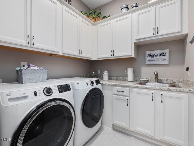 67 Spring Hollow Ct, Pittsboro, NC 27312 - washroom with washing machine and dryer, cabinet space, and light tile patterned floors