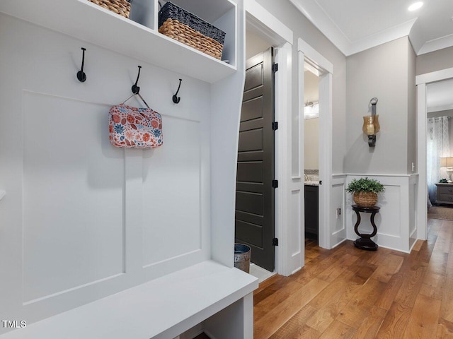 67 Spring Hollow Ct, Pittsboro, NC 27312 - mudroom with ornamental molding and light wood finished floors