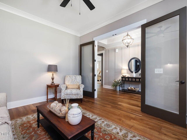67 Spring Hollow Ct, Pittsboro, NC 27312 - living room with a ceiling fan, wood finished floors, crown molding, and baseboards