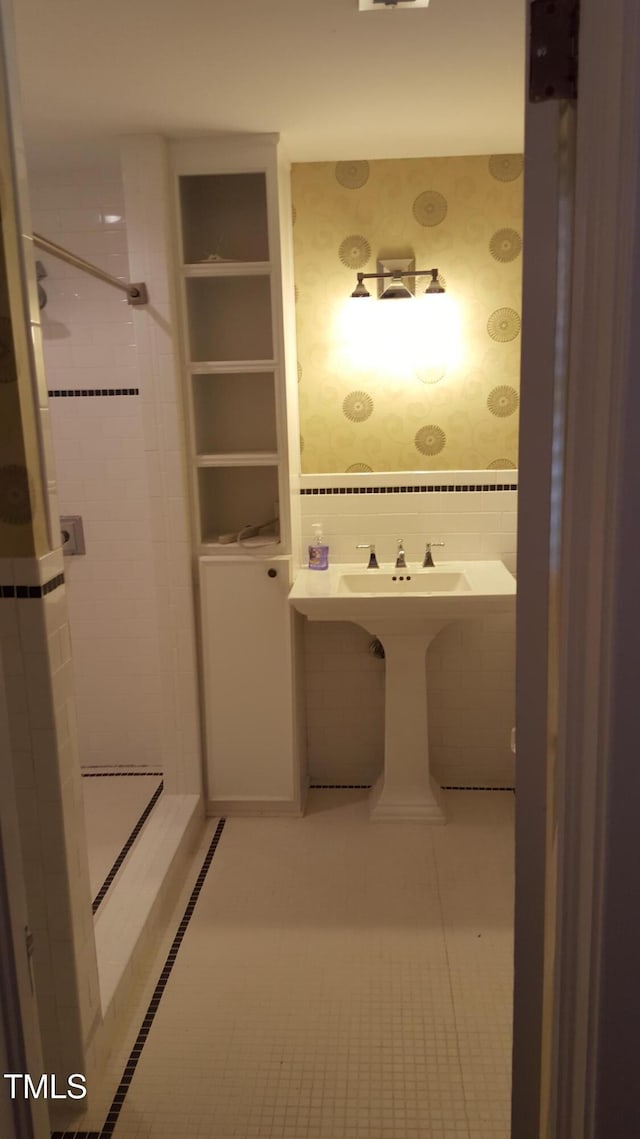 2236 The Cir, Raleigh, NC 27608 - bathroom featuring wallpapered walls, tile patterned flooring, and a tile shower
