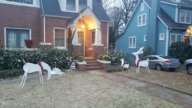 2236 The Cir, Raleigh, NC 27608 - view of front of house featuring brick siding and a shingled roof