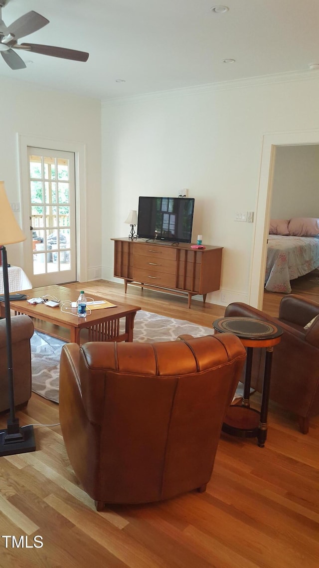 2236 The Cir, Raleigh, NC 27608 - living area featuring wood finished floors, a ceiling fan, and ornamental molding