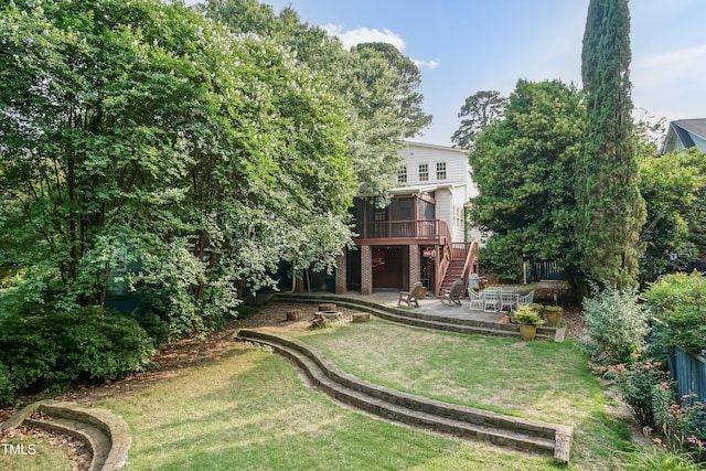 2236 The Cir, Raleigh, NC 27608 - rear view of property featuring stairs, a patio, a sunroom, a wooden deck, and a lawn