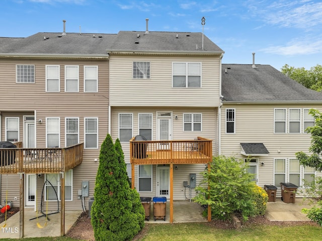 9808 Rainsong Dr, Wake Forest, NC 27587 - back of house with a patio, a wooden deck, and roof with shingles
