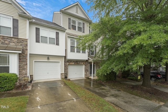 9808 Rainsong Dr, Wake Forest, NC 27587 - view of property with stone siding, concrete driveway, and a garage