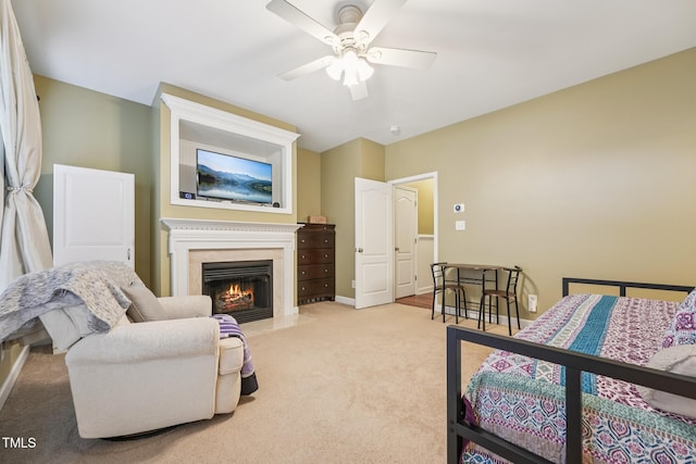 9808 Rainsong Dr, Wake Forest, NC 27587 - bedroom featuring light colored carpet, a fireplace with flush hearth, baseboards, and a ceiling fan