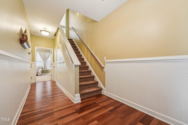 9808 Rainsong Dr, Wake Forest, NC 27587 - staircase featuring wood finished floors, wainscoting, and baseboards