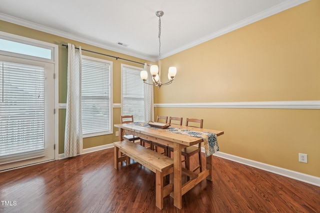 9808 Rainsong Dr, Wake Forest, NC 27587 - dining space featuring a chandelier, baseboards, wood finished floors, and crown molding