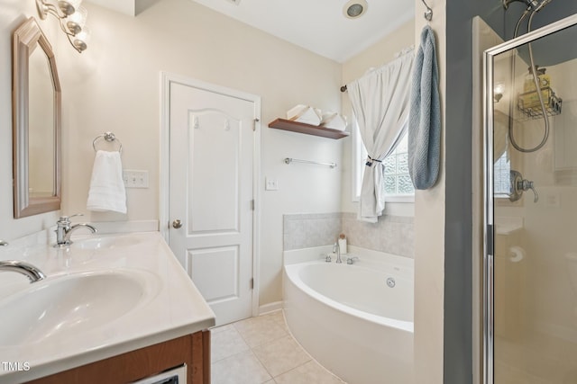 9808 Rainsong Dr, Wake Forest, NC 27587 - bathroom featuring a shower stall, double vanity, a garden tub, and tile patterned flooring