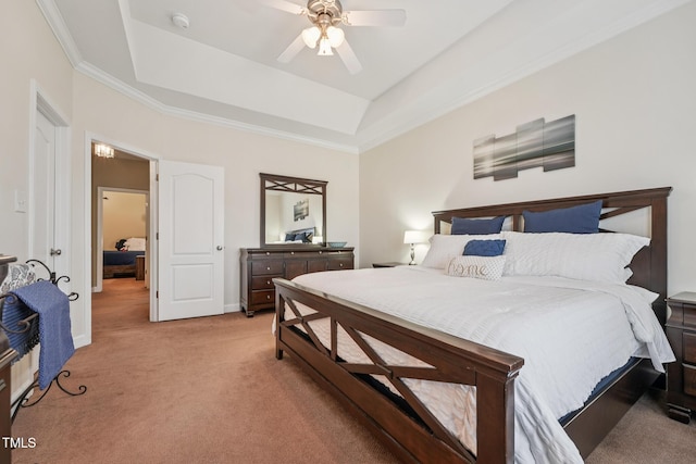 9808 Rainsong Dr, Wake Forest, NC 27587 - bedroom featuring a tray ceiling, light colored carpet, baseboards, ceiling fan, and ornamental molding