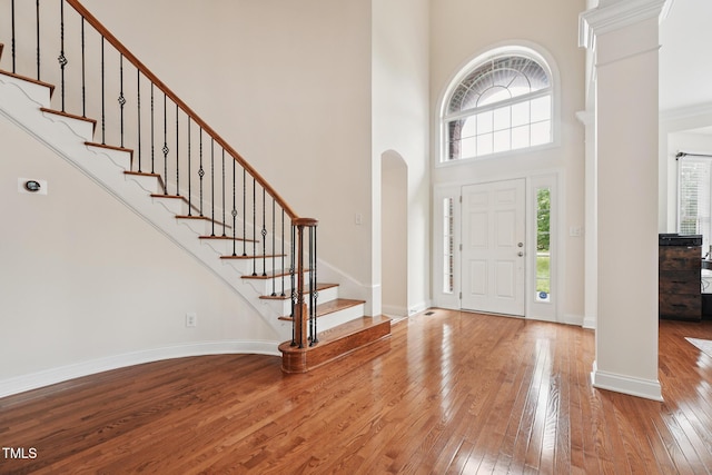 7 Teahouse Ct, Durham, NC 27707 - entrance foyer featuring decorative columns, hardwood / wood-style flooring, plenty of natural light, and a high ceiling