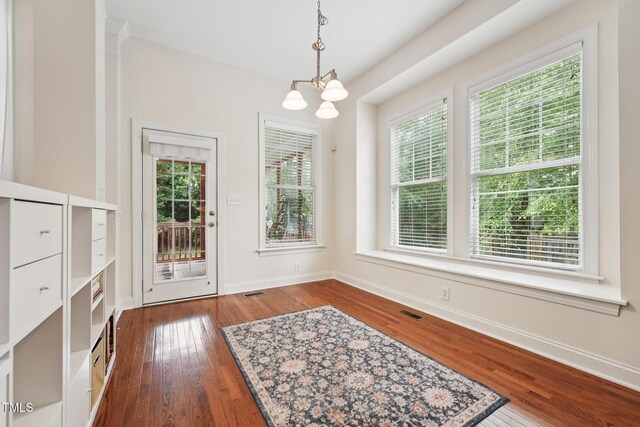 7 Teahouse Ct, Durham, NC 27707 - dining area featuring a chandelier, healthy amount of natural light, and dark wood-style flooring