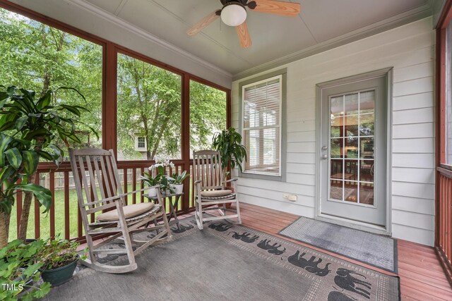 7 Teahouse Ct, Durham, NC 27707 - sunroom featuring a ceiling fan, ornamental molding, wood finished floors, and wooden walls