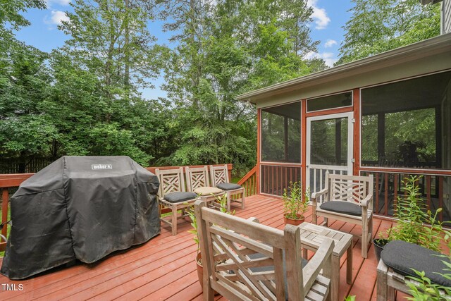 7 Teahouse Ct, Durham, NC 27707 - deck featuring area for grilling, a sunroom, and outdoor dining area