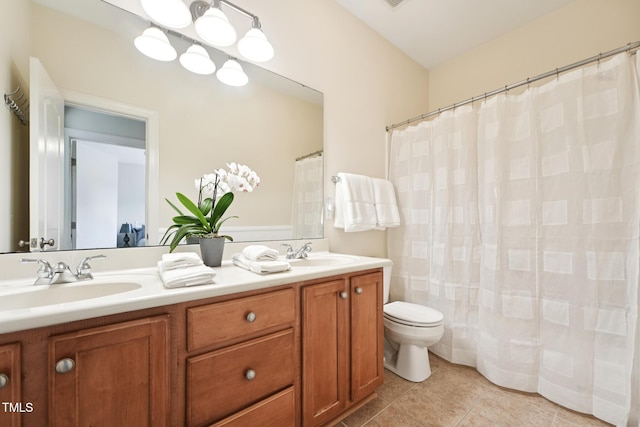 7 Teahouse Ct, Durham, NC 27707 - full bath with double vanity, toilet, tile patterned floors, and a shower with curtain