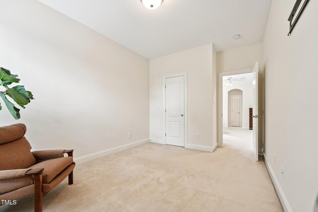 7 Teahouse Ct, Durham, NC 27707 - living area featuring light colored carpet, arched walkways, and baseboards
