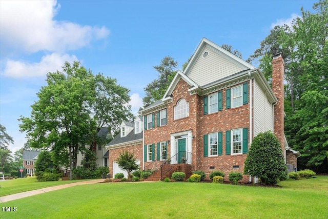 103 Rose Sky Ct, Cary, NC 27513 - colonial inspired home with brick siding, a front yard, and a chimney