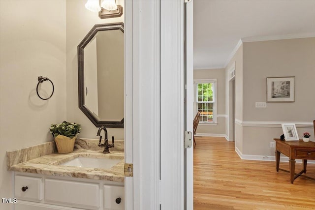 103 Rose Sky Ct, Cary, NC 27513 - bathroom featuring crown molding, wood finished floors, vanity, and baseboards