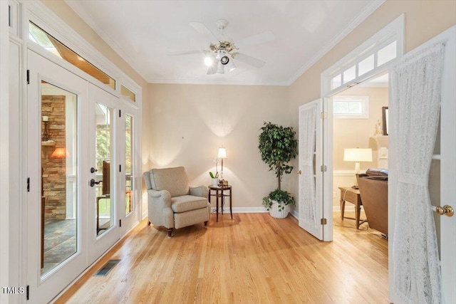 103 Rose Sky Ct, Cary, NC 27513 - living area with light wood-style flooring, baseboards, ceiling fan, ornamental molding, and french doors