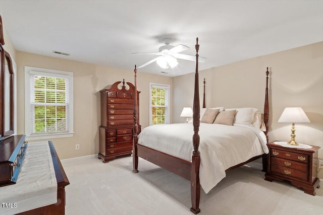103 Rose Sky Ct, Cary, NC 27513 - bedroom with light colored carpet, multiple windows, baseboards, and a ceiling fan