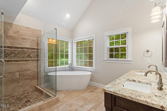 103 Rose Sky Ct, Cary, NC 27513 - full bath with a shower stall, a freestanding tub, double vanity, baseboards, and high vaulted ceiling
