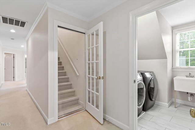 103 Rose Sky Ct, Cary, NC 27513 - washroom with washing machine and clothes dryer, crown molding, baseboards, marble look tile flooring, and recessed lighting
