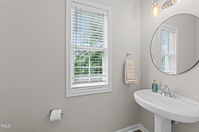 5942 Big Nance Dr, Raleigh, NC 27616 - bathroom featuring healthy amount of natural light, baseboards, and a sink