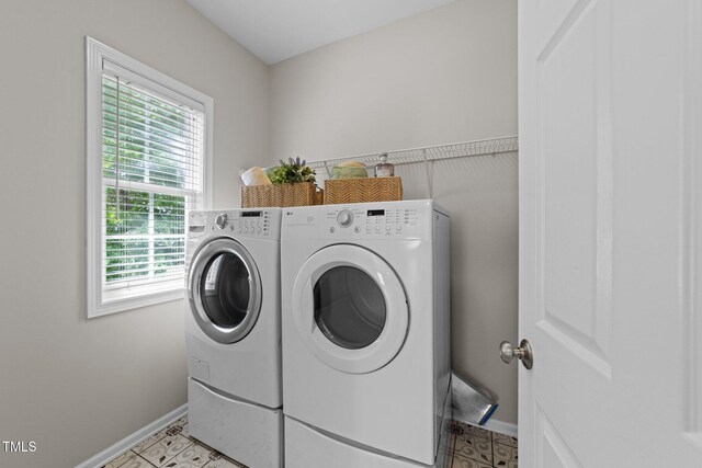 5942 Big Nance Dr, Raleigh, NC 27616 - laundry area featuring washer and dryer, baseboards, and light tile patterned floors