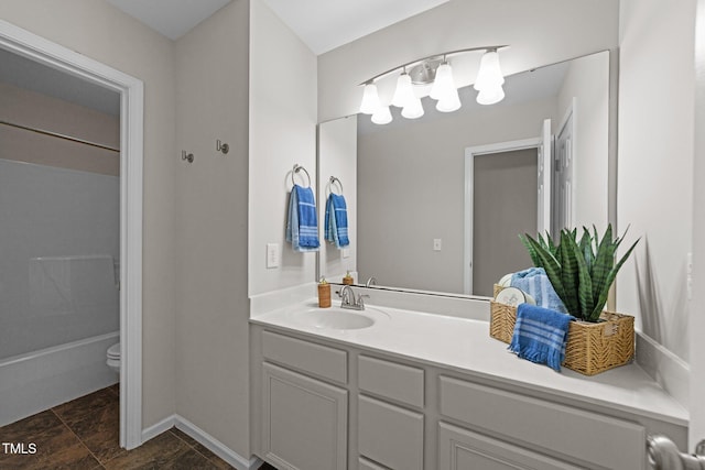 5942 Big Nance Dr, Raleigh, NC 27616 - full bathroom featuring vanity, toilet, a chandelier, baseboards, and shower / bathtub combination