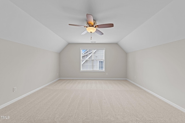 5942 Big Nance Dr, Raleigh, NC 27616 - bonus room featuring lofted ceiling, light colored carpet, baseboards, and ceiling fan