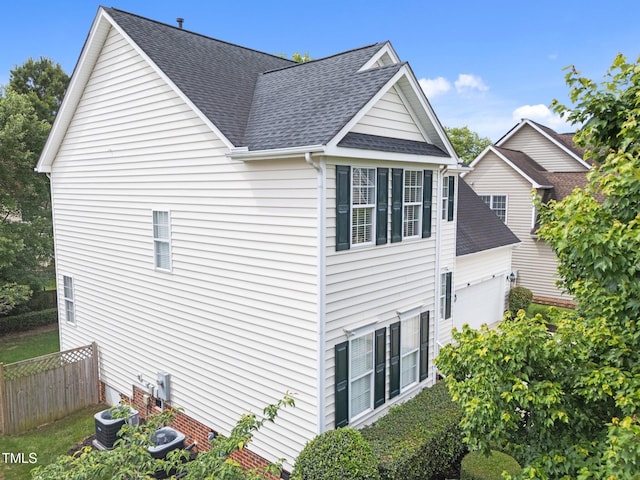 5942 Big Nance Dr, Raleigh, NC 27616 - view of home's exterior featuring roof with shingles and central air condition unit