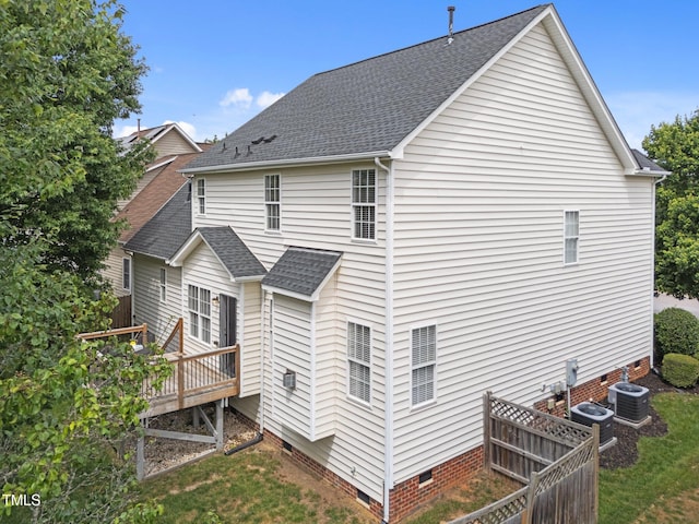 5942 Big Nance Dr, Raleigh, NC 27616 - rear view of property featuring crawl space, a deck, roof with shingles, and central AC unit