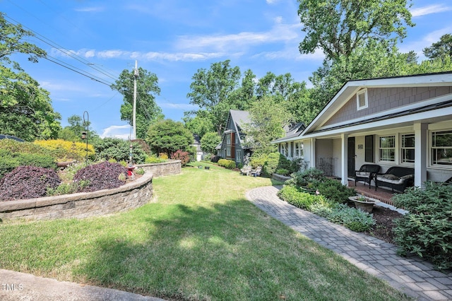 582 Wimbleton Dr, Raleigh, NC 27609 - view of green lawn with covered porch