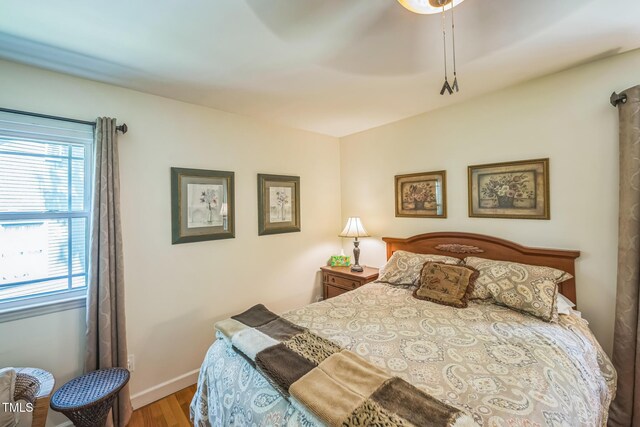 582 Wimbleton Dr, Raleigh, NC 27609 - bedroom with wood finished floors and baseboards