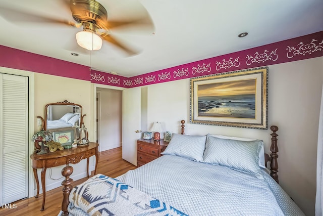 582 Wimbleton Dr, Raleigh, NC 27609 - bedroom featuring wood finished floors, a closet, and ceiling fan
