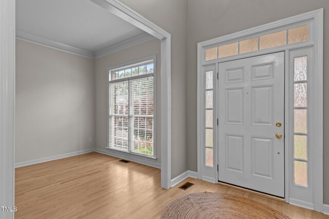13121 Sargas St, Raleigh, NC 27614 - foyer featuring crown molding, baseboards, and light wood-type flooring