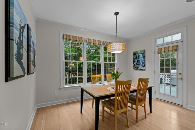 13121 Sargas St, Raleigh, NC 27614 - dining area with crown molding, light wood-type flooring, and baseboards