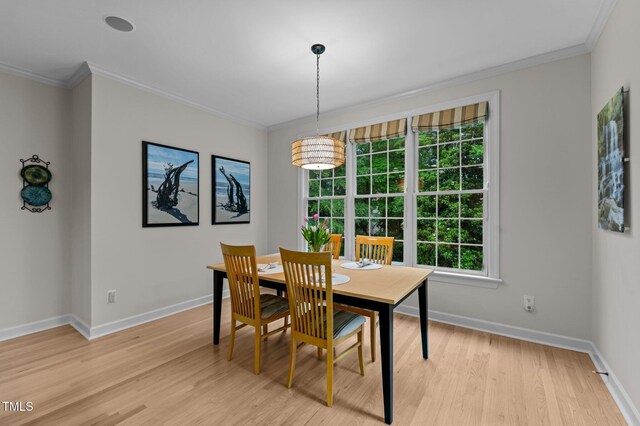 13121 Sargas St, Raleigh, NC 27614 - dining room with light wood-style flooring, ornamental molding, and baseboards