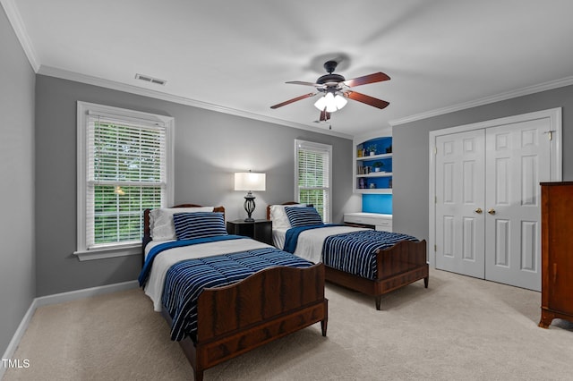13121 Sargas St, Raleigh, NC 27614 - bedroom featuring light carpet, crown molding, a closet, baseboards, and ceiling fan