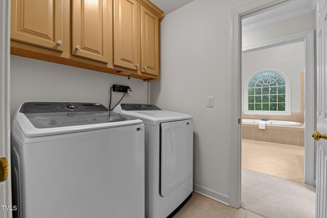 13121 Sargas St, Raleigh, NC 27614 - washroom with cabinet space, light tile patterned floors, independent washer and dryer, and crown molding
