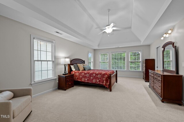 13121 Sargas St, Raleigh, NC 27614 - bedroom with light carpet, a raised ceiling, baseboards, and multiple windows