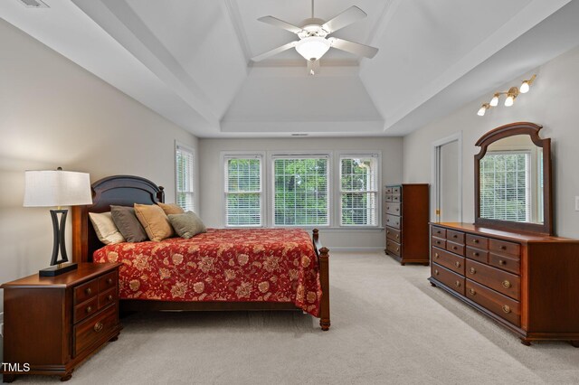 13121 Sargas St, Raleigh, NC 27614 - bedroom with a raised ceiling, light colored carpet, multiple windows, and ceiling fan