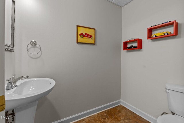 13121 Sargas St, Raleigh, NC 27614 - bathroom featuring toilet, baseboards, and a sink