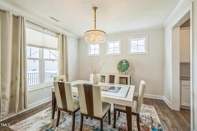 40 Two Creeks Loop, Chapel Hill, NC 27517 - dining space featuring a chandelier, ornamental molding, and dark wood-style flooring