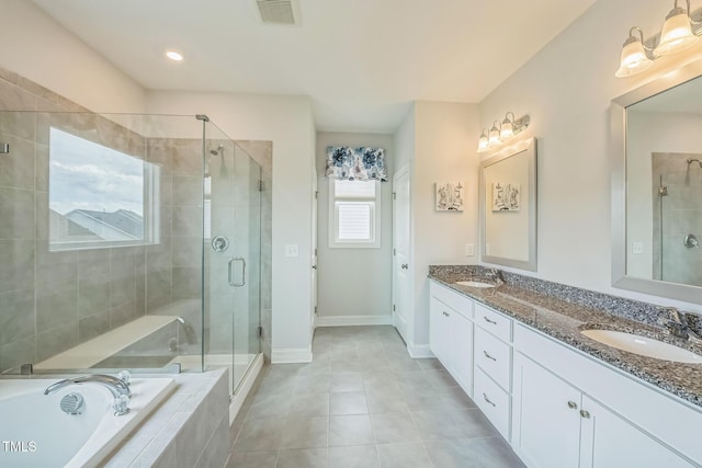 40 Two Creeks Loop, Chapel Hill, NC 27517 - bathroom featuring double vanity, a shower stall, a garden tub, and tile patterned flooring