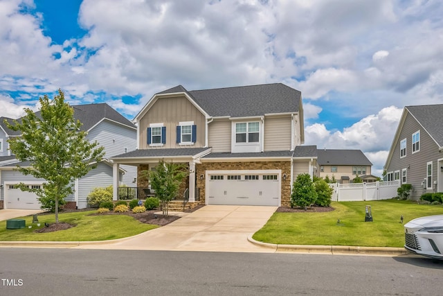 40 Two Creeks Loop, Chapel Hill, NC 27517 - craftsman inspired home featuring board and batten siding, concrete driveway, a garage, a porch, and stone siding